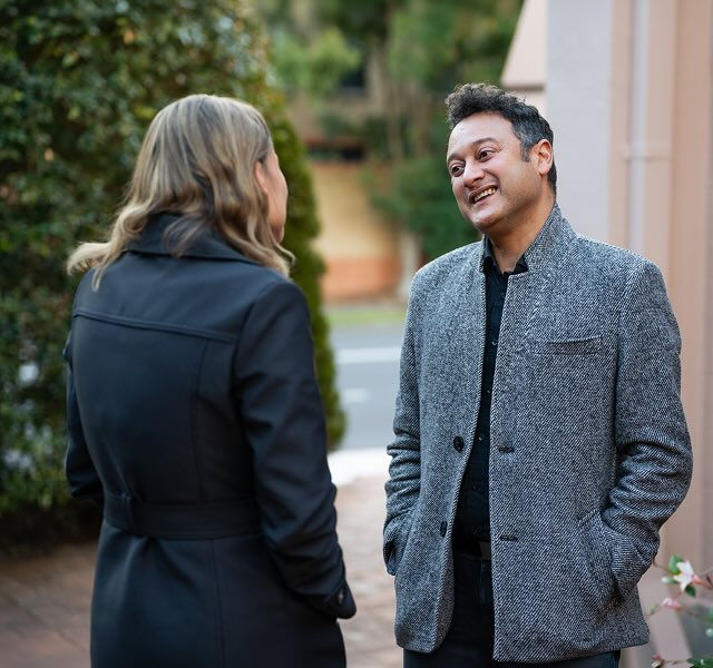 a man and a woman talking