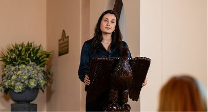 a woman conducting a eulogy