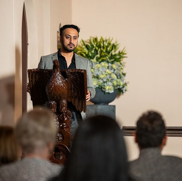 a man doing a eulogy