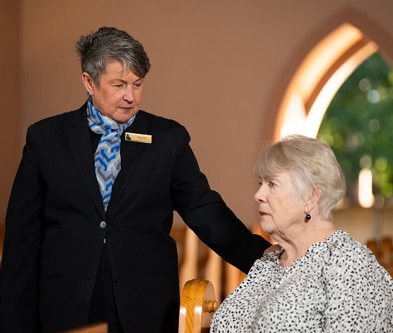 Allan Drew funeral director with a woman