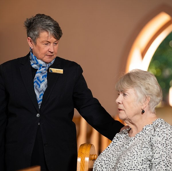 Allan Drew funeral director with a woman