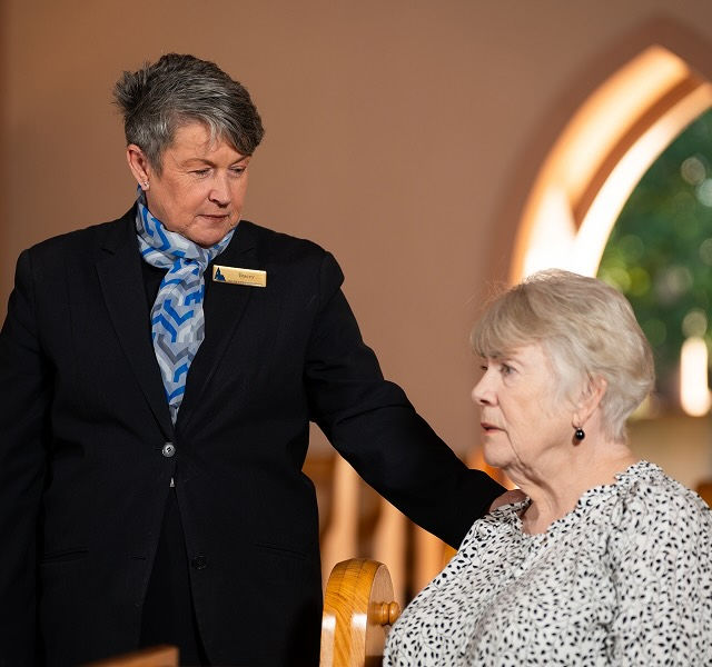 Allan Drew funeral director with a woman