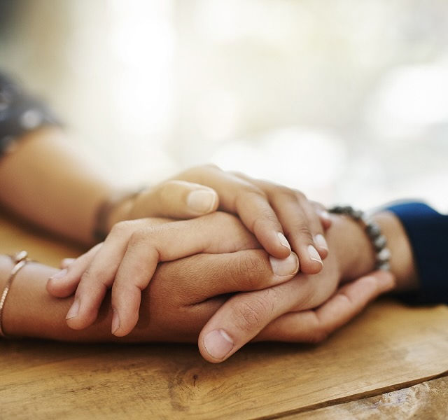 two people holding hands