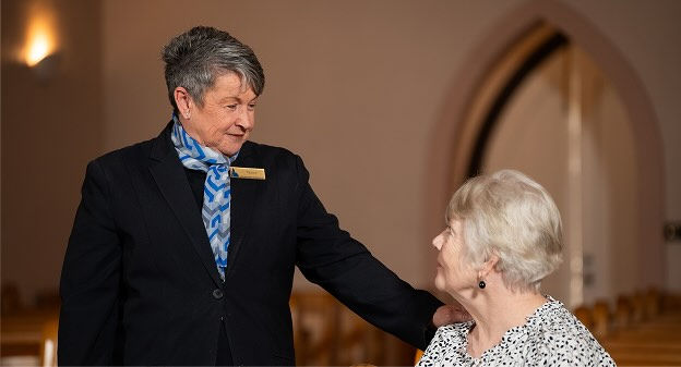 Allan Drew funeral director consoling a woman